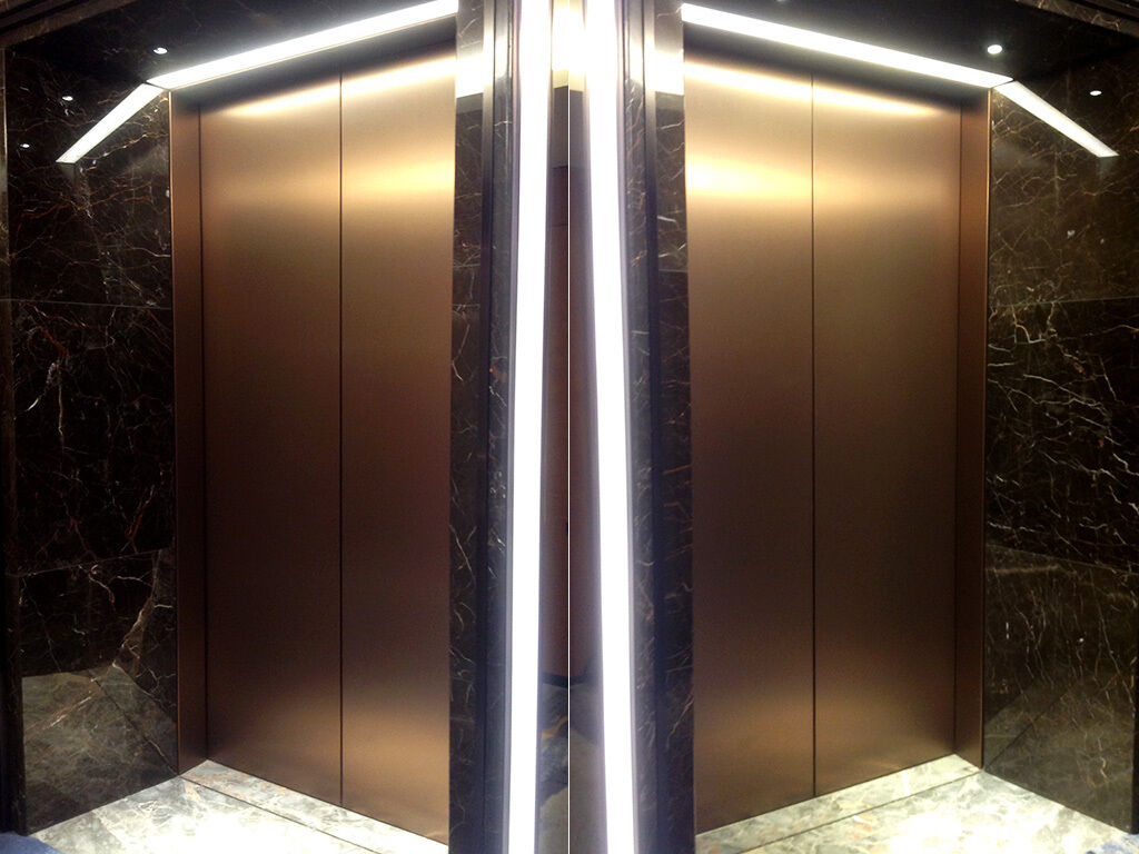 Bronze metallic effect 3M Di-Noc used to wrap lift doors